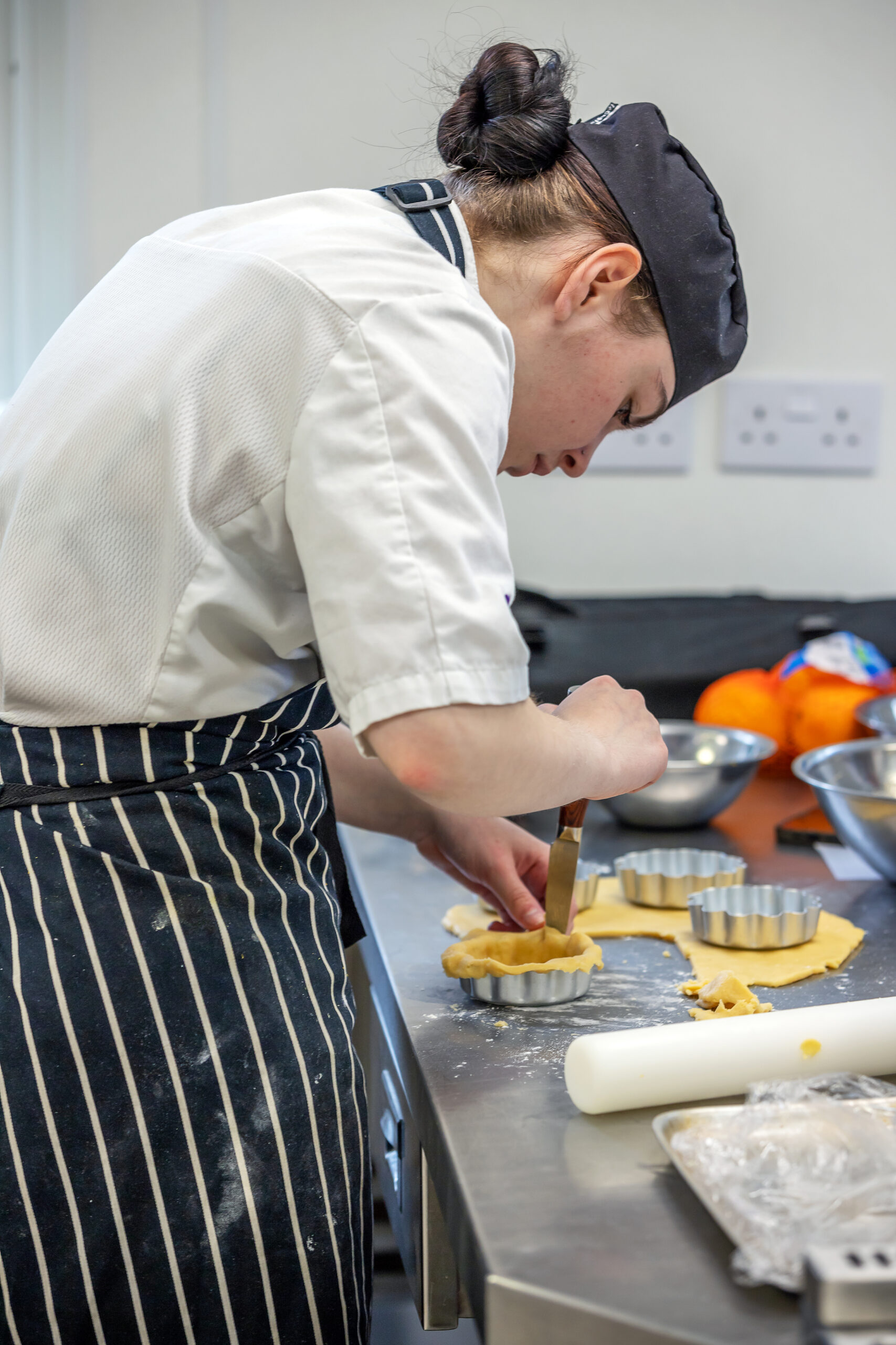 Young Person making pastry cases